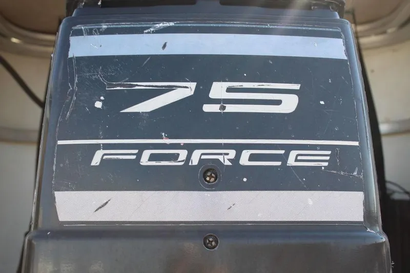 Slide: The Image of 1997 Monark Pontoon 75 Force outboard motor with visible wear. - 22