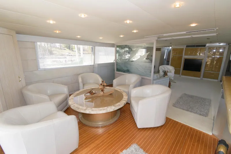 Slide: The Image of Luxurious interior of a 1984 Broward 100 yacht with elegant seating and modern decor. - 27