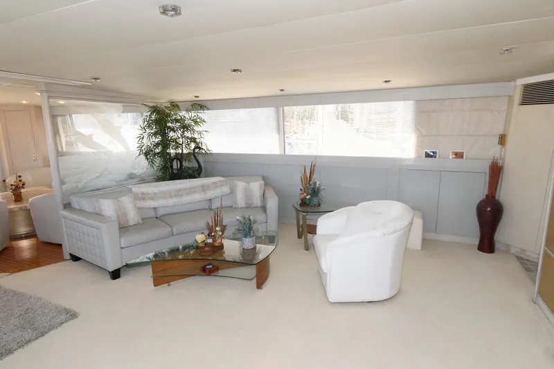Slide: The Image of Luxurious interior of 1984 Broward 100 yacht with modern furnishings and decor. - 31