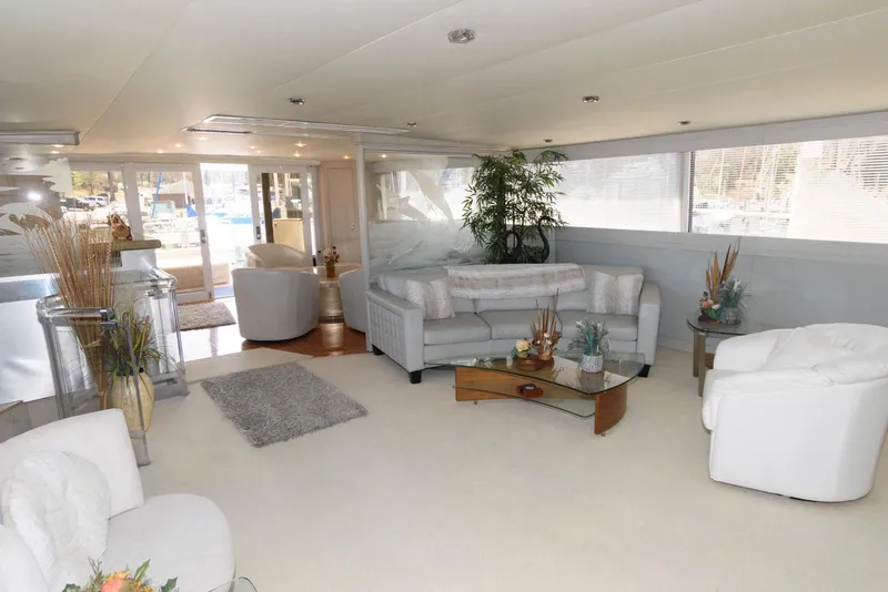 Slide: The Image of Luxurious interior of a 1984 Broward 100 yacht with modern furnishings and decor. - 32