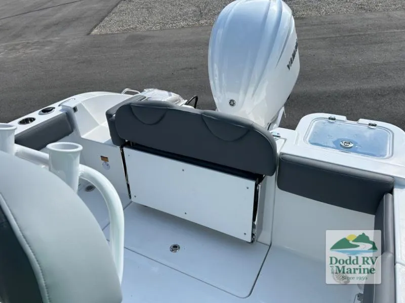 Slide: The Image of 2025 NauticStar 242 Offshore boat interior with seating and motor, displayed at Dodd RV Marine. - 12