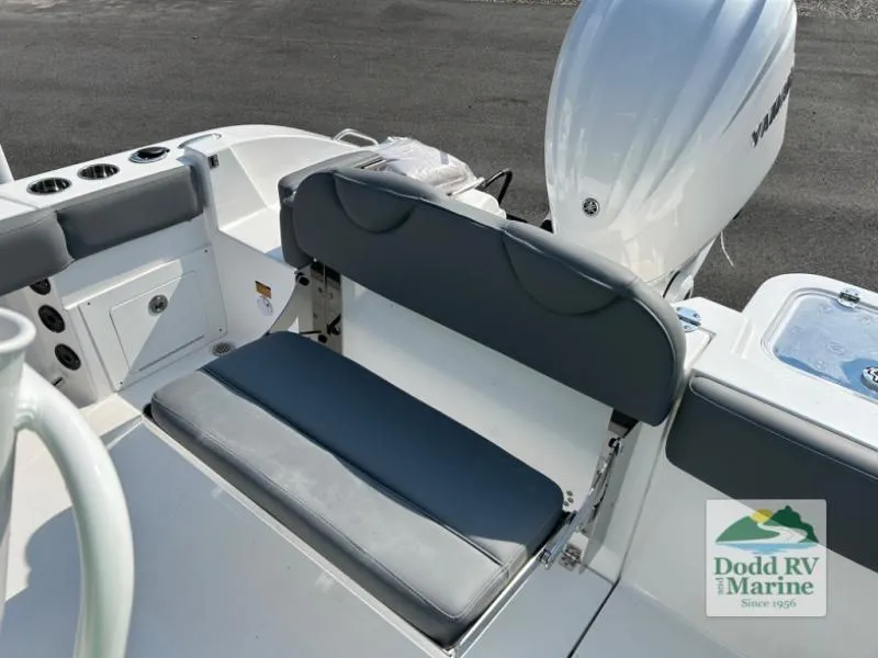 Slide: The Image of 2025 NauticStar 242 Offshore boat interior with seating and motor, Dodd RV Marine logo visible. - 14