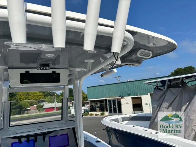 Slide: The Image of 2025 NauticStar 242 Offshore boat at Dodd RV Marine dealership, showcasing interior features. - 16