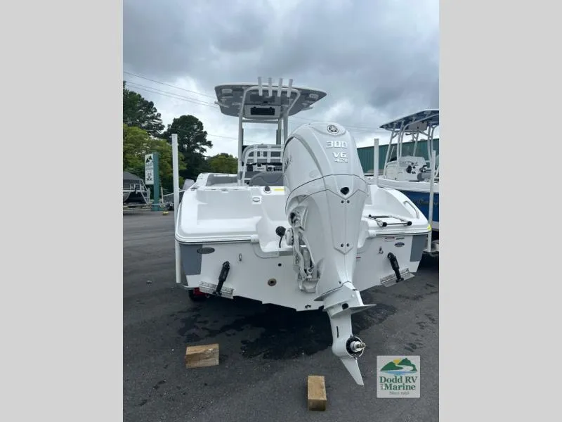 Slide: The Image of 2025 NauticStar 242 Offshore boat with powerful outboard motor, displayed at Dodd RV Marine. - 9