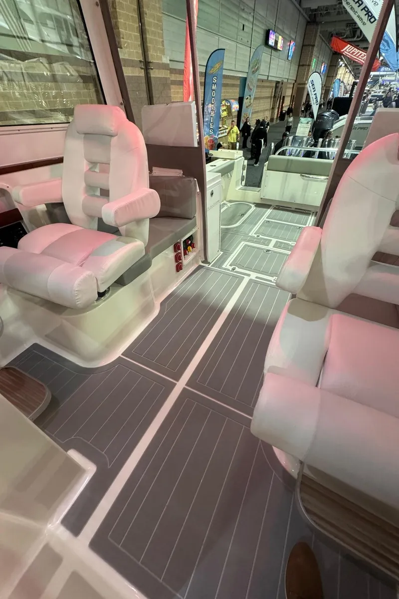 Slide: The Image of 2025 NorthCoast 315 HT boat interior with modern seating and sleek design. - 22