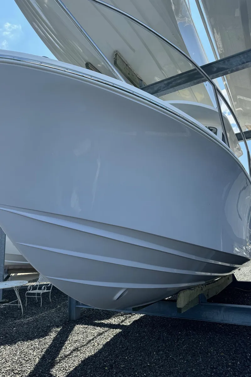 Slide: The Image of 2025 NorthCoast 315 HT boat on display, showcasing sleek hull design. - 3