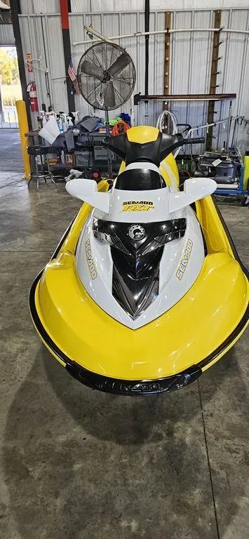 Slide: The Image of 2009 Sea-Doo RXT™ 215 jet ski in a garage, yellow and white design. - 3