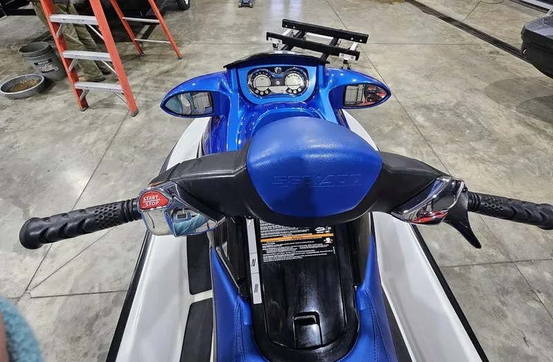 Slide: The Image of 2007 Sea-Doo GTX 4-TEC™ jet ski, blue and white, dashboard view in a garage. - 4