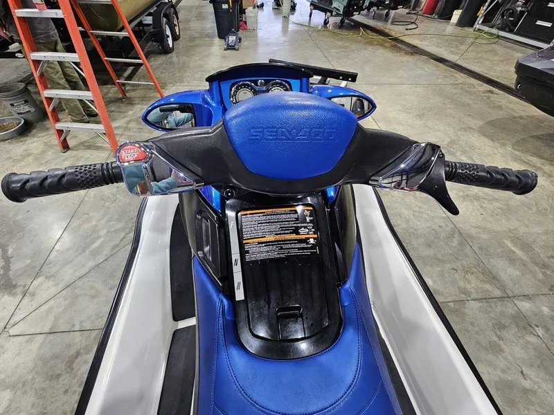 Slide: The Image of 2007 Sea-Doo GTX 4-TEC™ jet ski, blue seat, handlebars, indoor setting. - 6