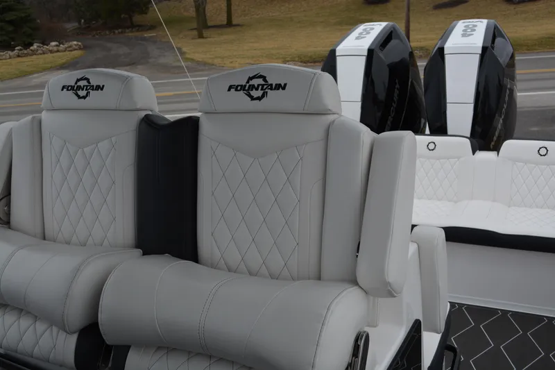 Slide: The Image of 2025 Fountain 34 CC boat with luxurious seating and dual engines. - 14
