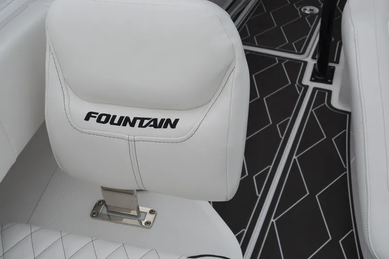 Slide: The Image of 2025 Fountain 34 CC boat seat with logo and geometric flooring design. - 23