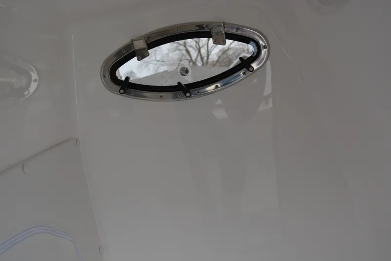 Slide: The Image of Oval window on 2025 Fountain 34 CC boat interior. - 27