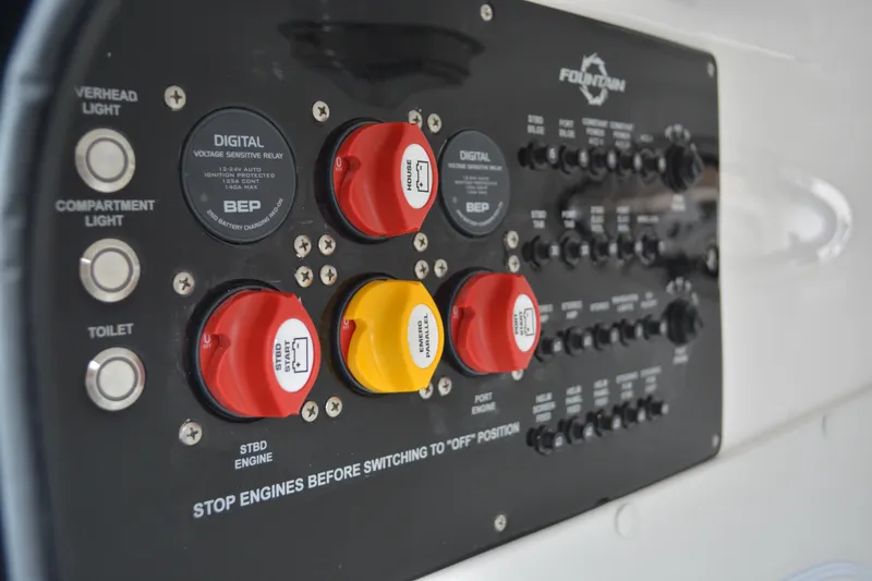 Slide: The Image of Control panel of a 2025 Fountain 34 CC boat with switches and indicators. - 30