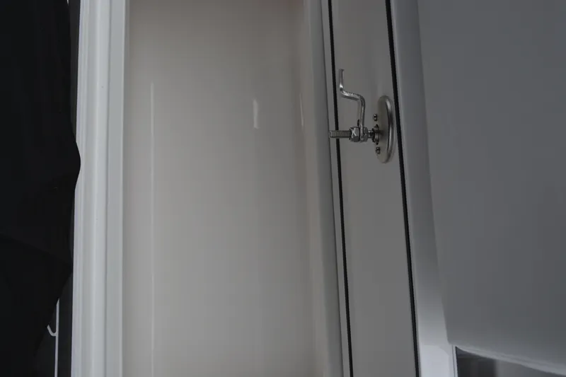 Slide: The Image of 2025 Fountain 34 CC interior detail with sleek, modern design and chrome fixtures. - 34