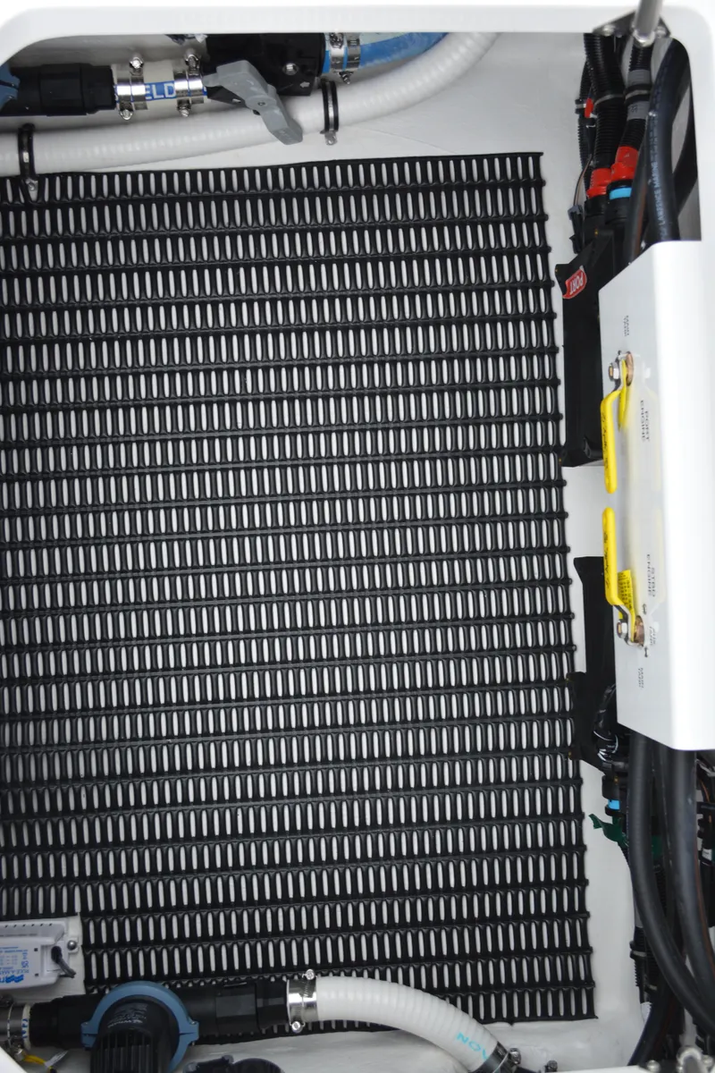 Slide: The Image of Engine compartment of 2025 Fountain 34 CC boat with visible components and wiring. - 35