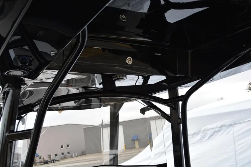 Slide: The Image of Interior view of a 2025 Fountain 34 CC boat, showcasing sleek black framework. - 6