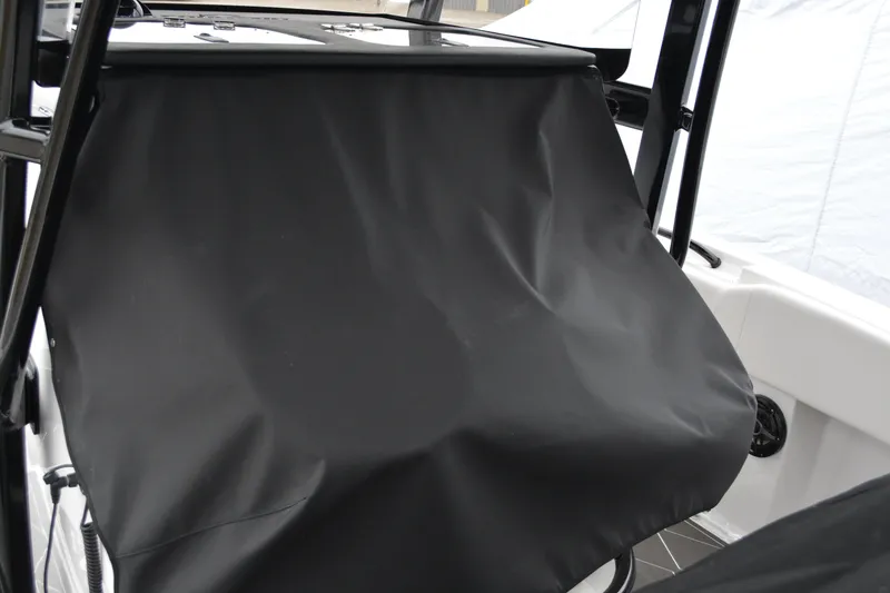 Slide: The Image of 2025 Fountain 34 CC boat with black protective cover on console. - 7