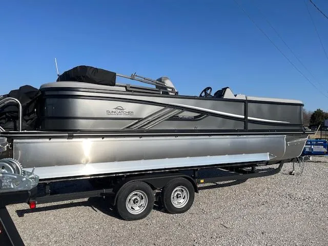 Slide: The Image of 2025 SunCatcher Fusion 324RC pontoon boat on trailer, side view. - 10