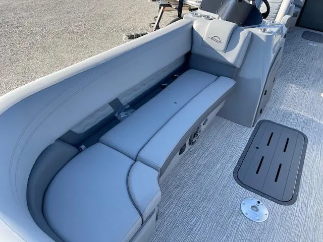 Slide: The Image of 2025 SunCatcher Fusion 324RC boat interior with gray seating and modern design. - 14
