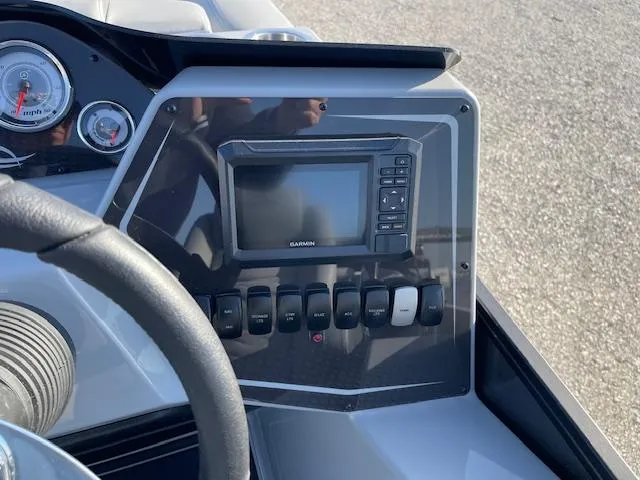Slide: The Image of Dashboard of 2025 SunCatcher Fusion 324RC with Garmin display and controls. - 23