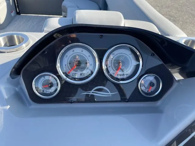 Slide: The Image of Dashboard of 2025 SunCatcher Fusion 324RC boat with gauges and controls. - 24