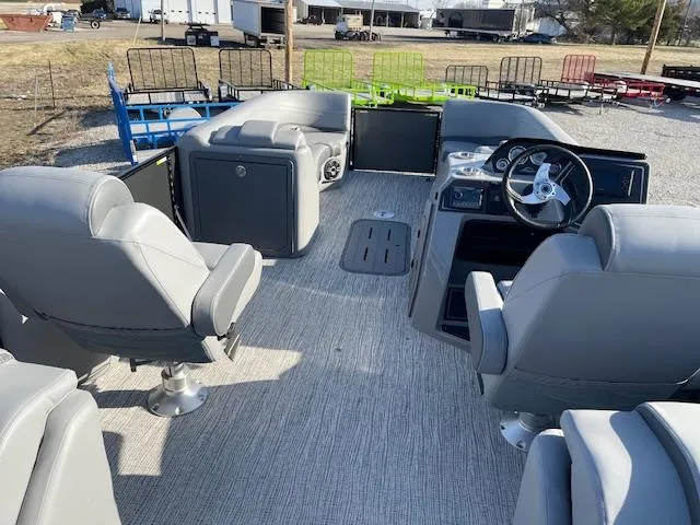 Slide: The Image of Interior of 2025 SunCatcher Fusion 324RC pontoon boat with gray seating and steering console. - 26