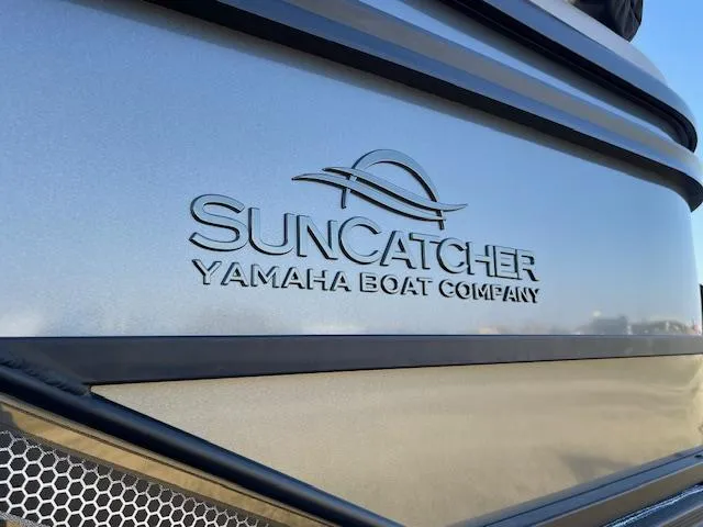 Slide: The Image of 2025 SunCatcher Fusion 324RC boat by Yamaha, sleek metallic design. - 6