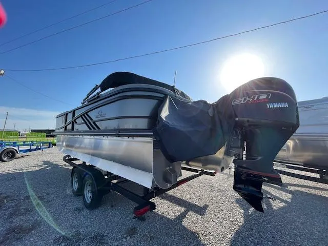 Slide: The Image of 2025 SunCatcher Fusion 324RC boat with Yamaha engine on trailer, sunny day. - 7