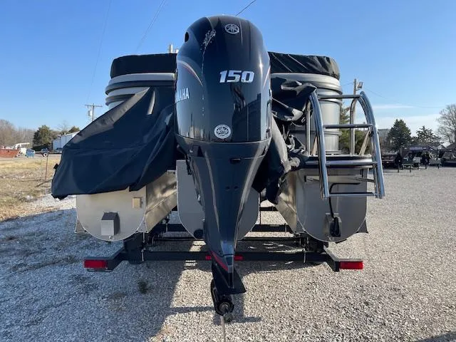 Slide: The Image of 2025 SunCatcher Fusion 324RC pontoon boat with Yamaha 150 outboard motor, rear view. - 8