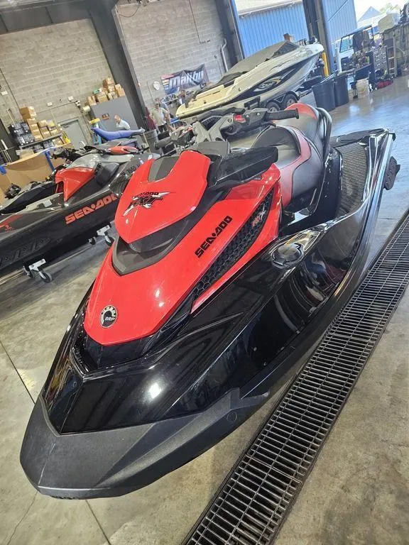 Slide: The Image of 2014 Sea-Doo RXT-X 260 jet ski in a garage setting. - 12