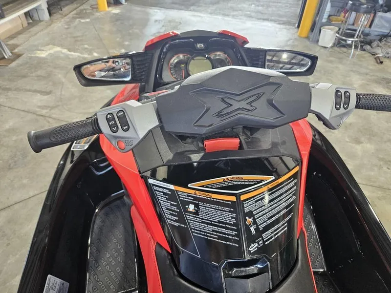 Slide: The Image of 2014 Sea-Doo RXT-X 260 jet ski dashboard and handlebars in a garage setting. - 7