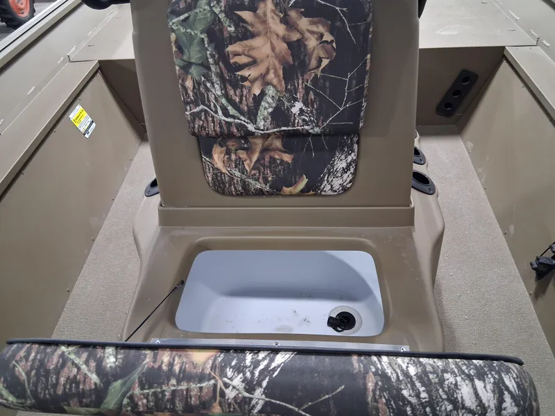 Slide: The Image of 2025 G3 Gator Tough 18 CC boat interior with camo seats and storage compartment. - 11