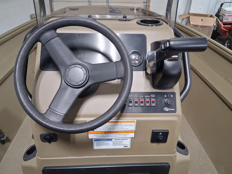 Slide: The Image of 2025 G3 Gator Tough 18 CC boat console with steering wheel and control panel. - 12