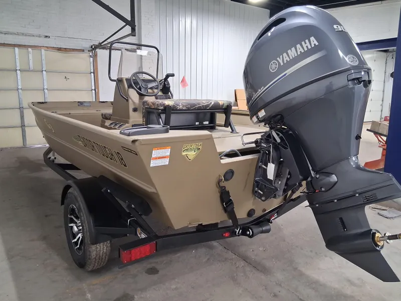 Slide: The Image of 2025 G3 Gator Tough 18 CC boat with Yamaha outboard motor in a garage. - 4