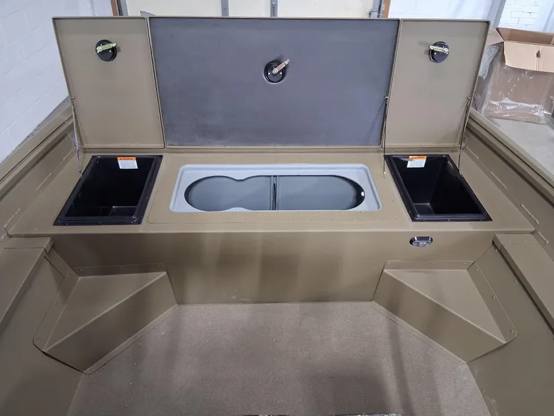 Slide: The Image of 2025 G3 Gator Tough 18 CC boat interior with storage compartments and seating. - 8