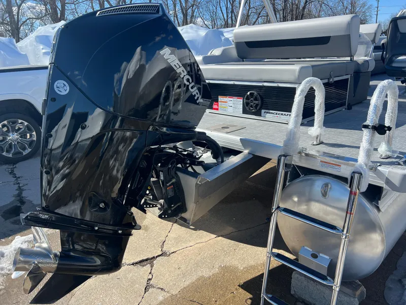 Slide: The Image of 2025 Princecraft Vectra 25 RL pontoon boat with Mercury outboard motor and ladder. - 2