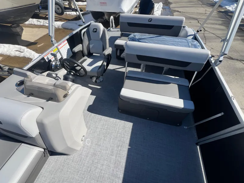 Slide: The Image of 2025 Princecraft Vectra 25 RL pontoon boat interior with modern seating and steering console. - 6