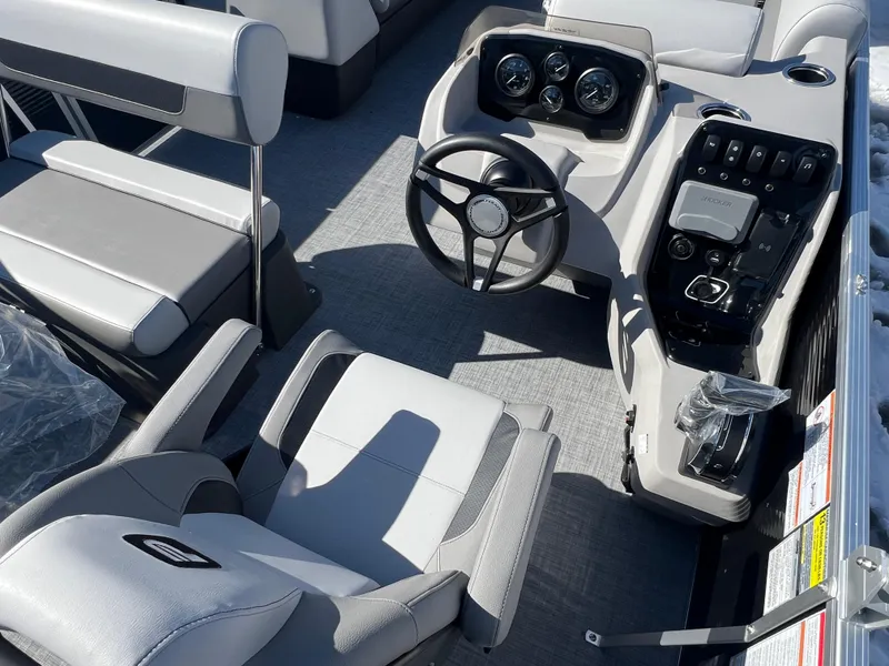 Slide: The Image of 2025 Princecraft Vectra 25 RL boat interior with modern steering console and seating. - 9