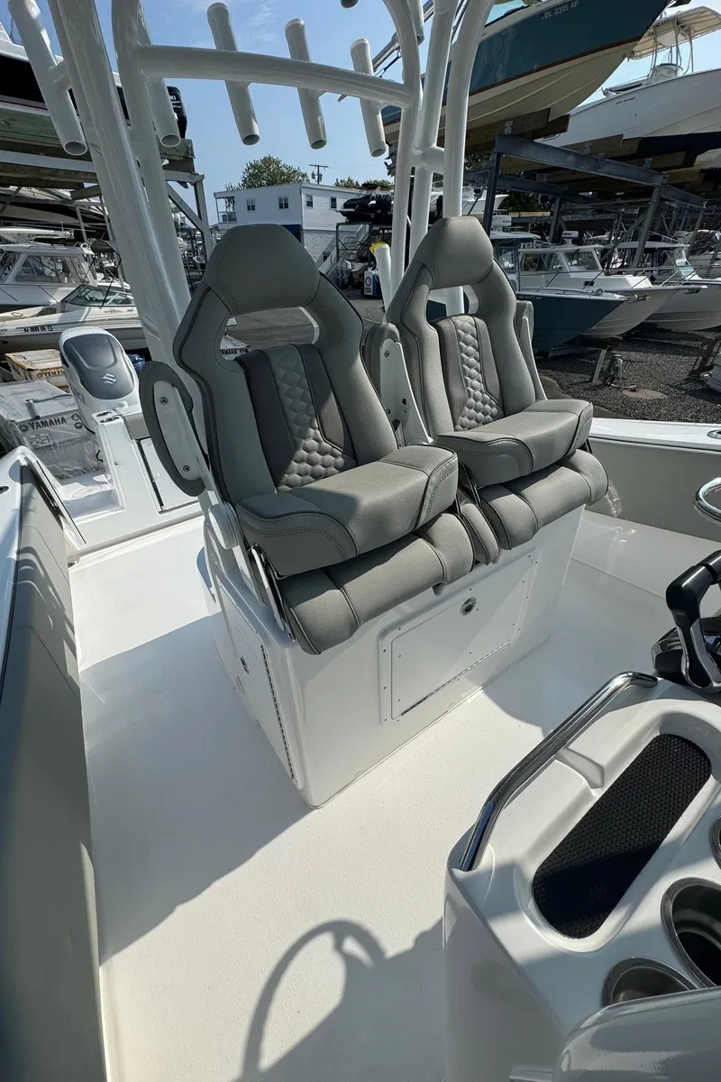 Slide: The Image of 2025 Cape Horn 32 XS boat interior with dual cushioned seats and modern design. - 13