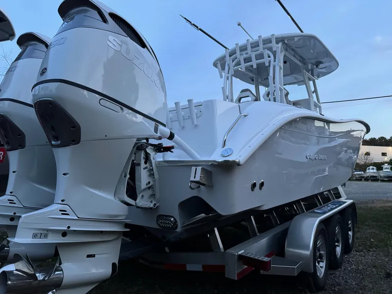 Slide: The Image of 2025 Cape Horn 32 XS boat on trailer, featuring dual outboard engines. - 3