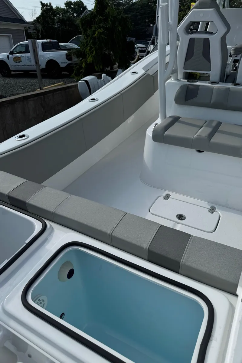 Slide: The Image of 2025 Cape Horn 32 XS boat interior with seating and storage compartments. - 6