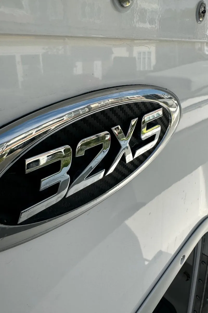 Slide: The Image of Cape Horn 32 XS 2025 model emblem on a sleek white surface. - 7