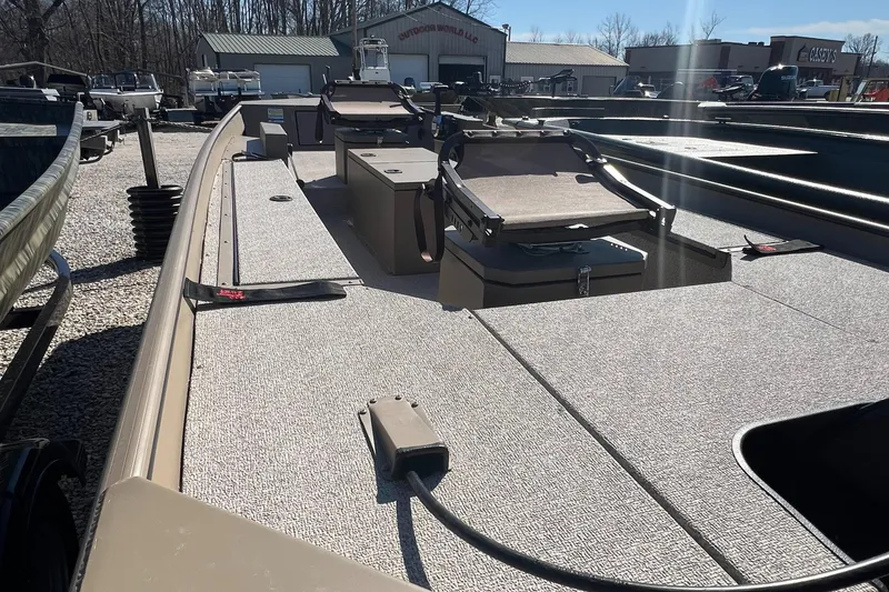 Slide: The Image of 2025 SeaArk 1652 Crappie boat with spacious deck and storage compartments. - 11