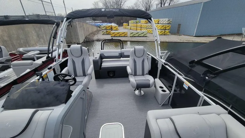Slide: The Image of 2025 Godfrey Monaco 235 DFL pontoon boat with luxurious seating and modern design. - 3