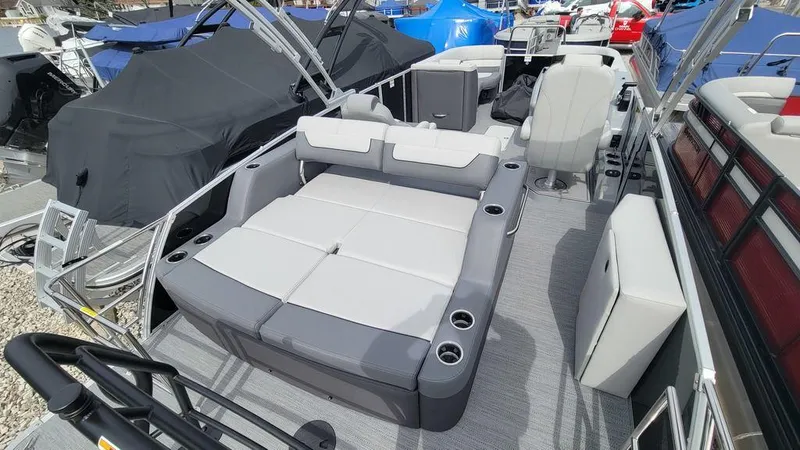 Slide: The Image of 2025 Godfrey Monaco 235 DFL boat with spacious seating and modern design. - 4