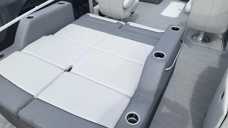 Slide: The Image of Luxurious seating on 2025 Godfrey Monaco 235 DFL boat with cup holders and modern design. - 6