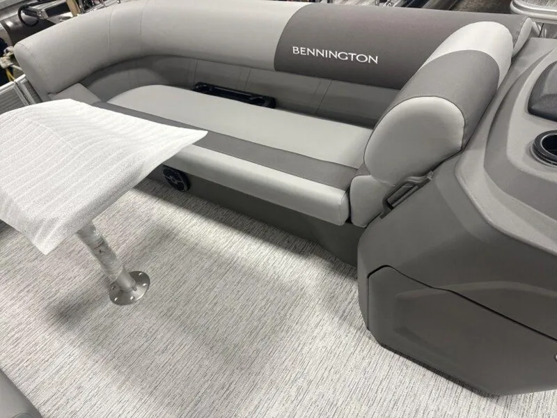 Slide: The Image of 2025 Bennington S Swingback 22 SSB interior with gray seating and table. - 13