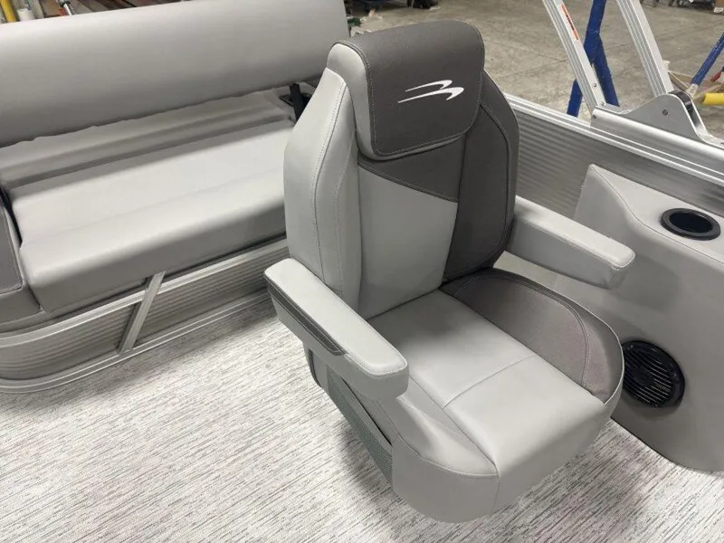 Slide: The Image of 2025 Bennington S Swingback 22 SSB boat interior with gray seating and armrests. - 16