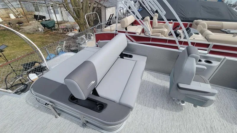 Slide: The Image of 2025 Bennington S Swingback 22 SSB pontoon boat with gray seating and modern design. - 17