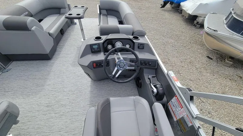 Slide: The Image of 2025 Bennington S Swingback 22 SSB pontoon boat interior with modern helm and seating. - 3